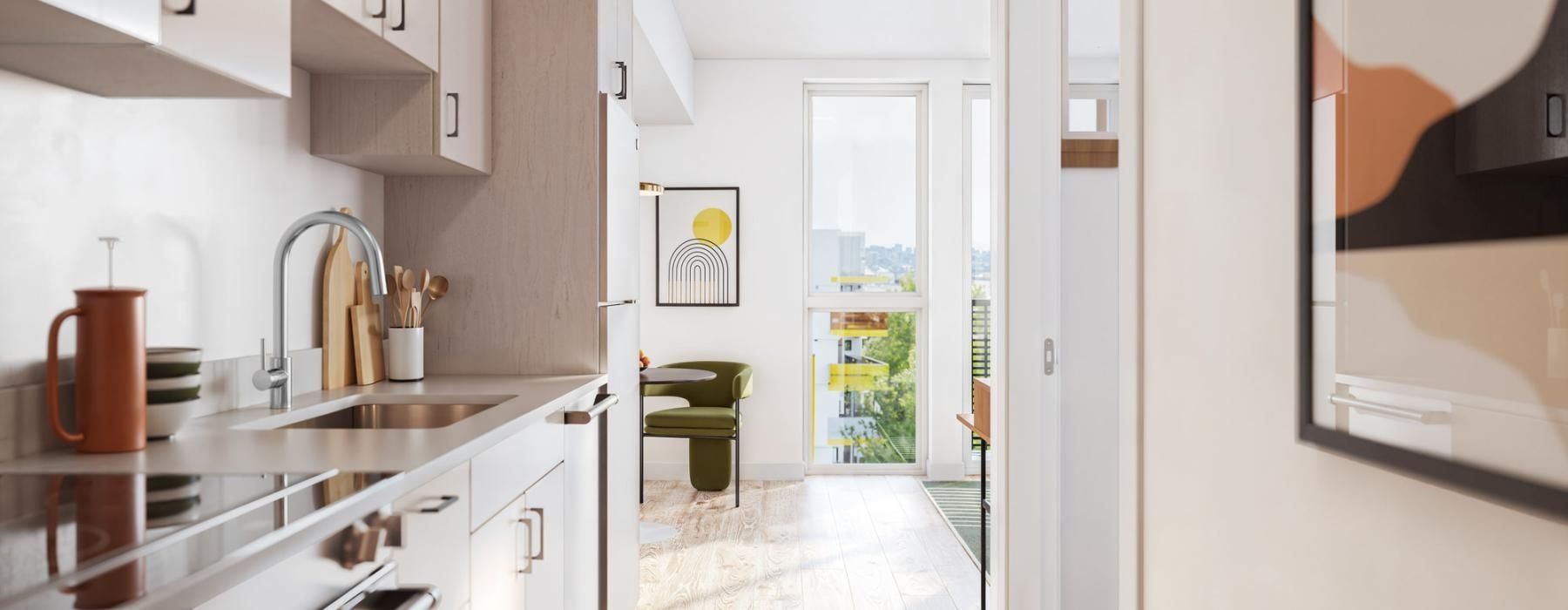 a kitchen with light colored cabinets