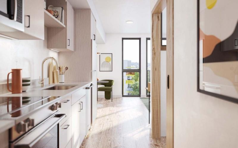 a kitchen with light colored cabinets